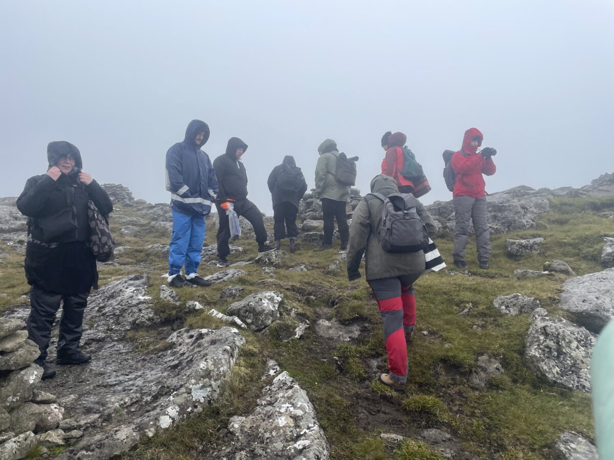 The With the River Collective's members in fog.